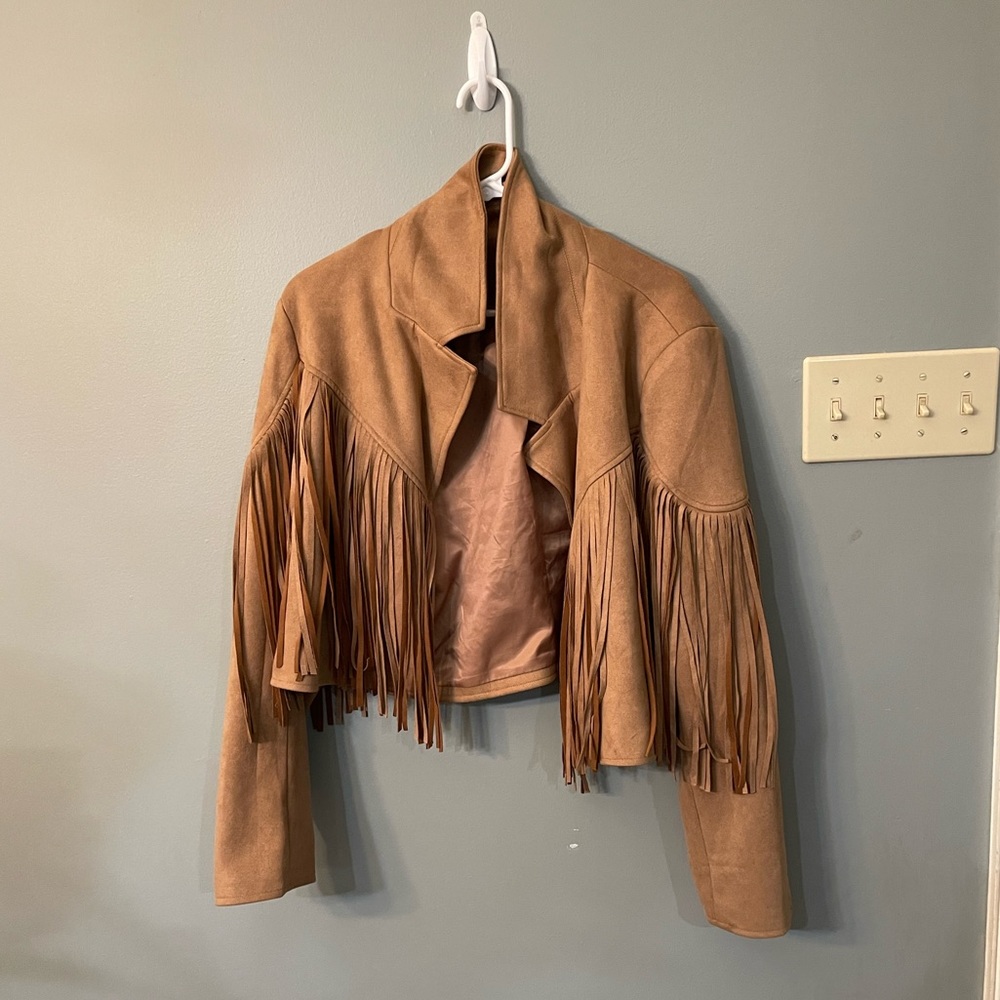 I am selling a brown light weight jacket with fringe from Arula